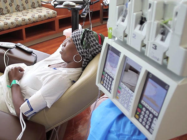 woman-with-headscarf-getting-chemo-treatment-article